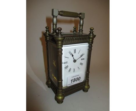 20th Century brass cased carriage clock having enamel dial with Roman numerals (cracked corner of dial) with key, 5.25ins, 3.