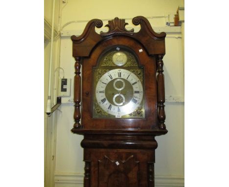 19th Century North Country mahogany longcase clock, the arched hood with swan neck pediment above a shaped door and a circula