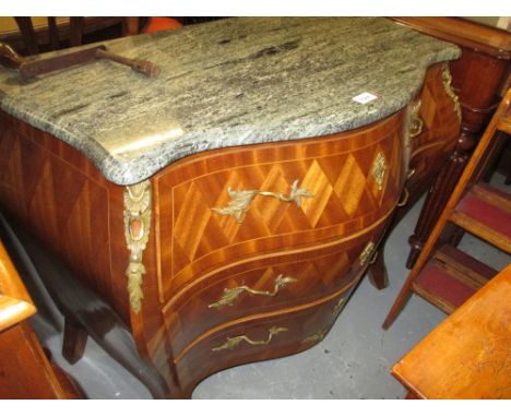 Early 20th Century Continental bombe commode, the marble top above three parquetry decorated drawers with gilt brass floral h