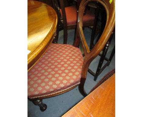 Set of six 19th Century walnut balloon back dining chairs having overstuffed upholstered seats raised on turned tapering reed