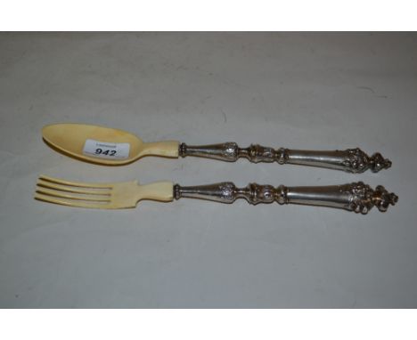 Pair of 19th Century Continental white metal and ivory salad servers with mask head finial