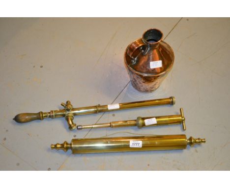 Brass rolling pin, brass syringe and a fire hose nozzle, copper jug and two copper warming pans