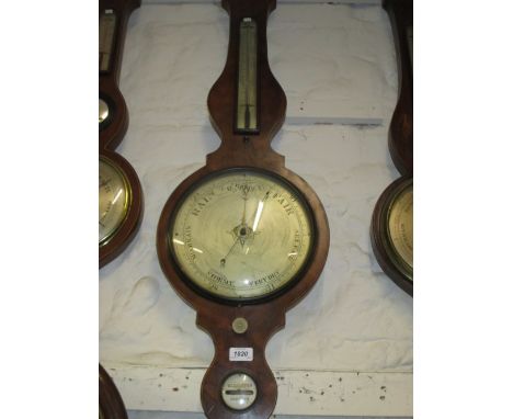 George III mahogany and line inlaid banjo shaped wheel barometer with a broken arch pediment and large silvered dial