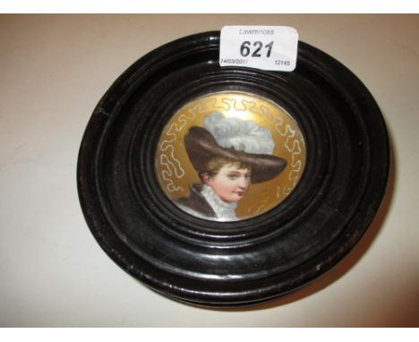 Small Continental porcelain concave plaque painted with a portrait of a lady wearing a feathered hat in a circular ebonised f