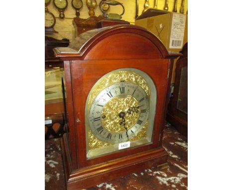 Edwardian mahogany musical bracket clock, the broken arch case with brass carrying handle and ogee bracket feet, the engraved