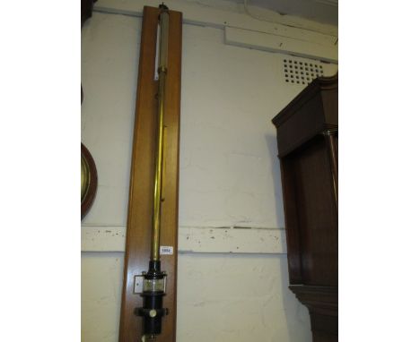 Early 20th Century lacquered brass and black Japanned marine barometer by Negretti and Zambra, London, mounted to a rectangul
