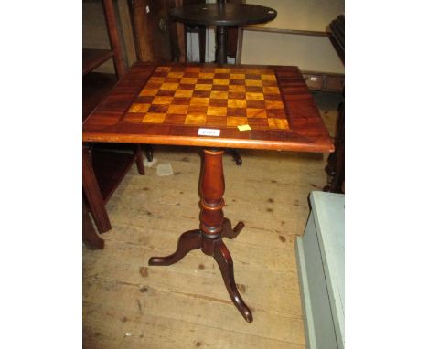 19th Century mahogany and inlaid pedestal games table with a chequer board top above a turned column support and tripod