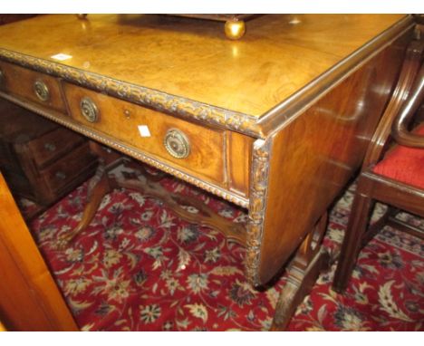 Good quality figured walnut drop-leaf sofa table, the carved moulded top above two frieze drawers raised on lyre shaped end s