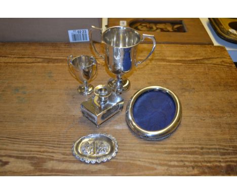 Small oval silver photograph frame, two silver trophy cups, silver matchbox / candlestick and other small items of silver