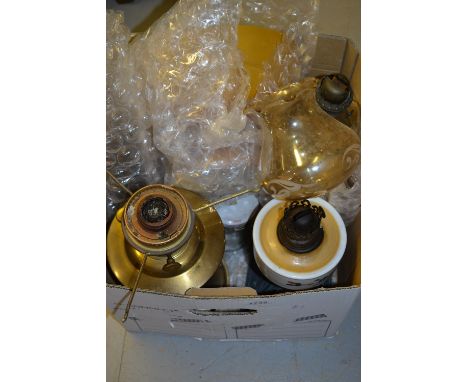 Brass oil lamp with shade and chimney together with a quantity of other oil lamps