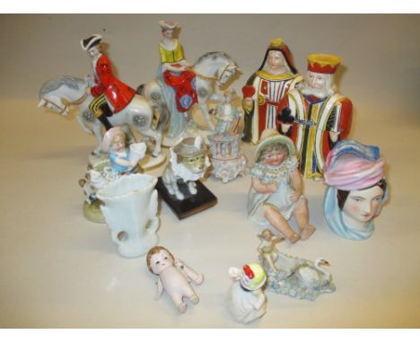 Pair of Continental porcelain equestrian figures, a pair of Continental porcelain playing cards boxes in the form of a King a