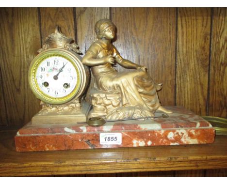 19th Century French gilded spelter mantel clock, in the form of a seated female figure beside a drum clock, the floral painte