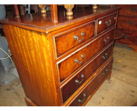 Reproduction figured walnut straight front chest of two short and three long drawers on bracket feet