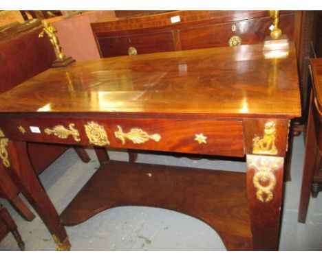 19th Century figured mahogany and gilt brass mounted console table of French Empire design, the top mounted with a pair of ch