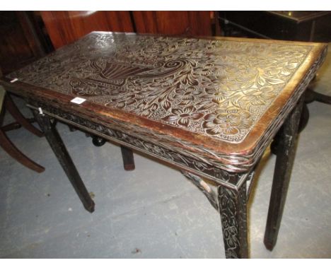 Georgian mahogany fold-over card table raised on square chamfered supports with all-over later floral carved decoration