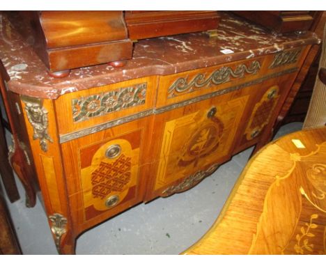 20th Century Continental walnut marquetry inlaid commode chest having rouge marble top, above three drawers with gilt brass m