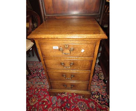 Good quality reproduction oak chest of four graduated drawers with brass handles and bracket feet