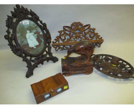 Black Forest carved oval easel mirror, similar folding shelf and dish, carving of a Kiwi and a pair of wooden stereoscope vie