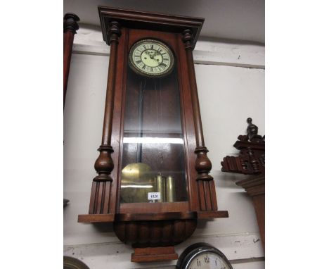 Late 19th Century walnut cased Vienna style wall clock, the enamel dial with Roman numerals and subsidiary seconds and two tr