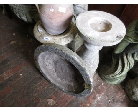 Small carved marble garden planter with pedestal base together with a cast concrete bird bath