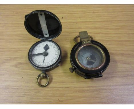 Steward of London black Japanned and brass military compass together with a Steward Verner compass