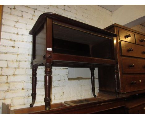 19th Century mahogany side table with brass rail above a recess on turned tapering supports with brass caps and ceramic caste