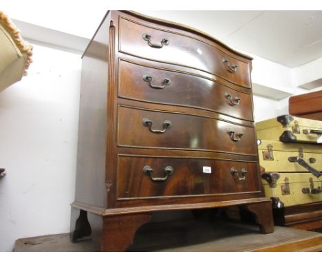 Reproduction mahogany serpentine fronted chest of four long drawers with brass swan neck handles raised on bracket feet
