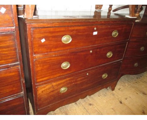 George III mahogany straight front chest of three graduated drawers with oval brass handles raised on bracket feet