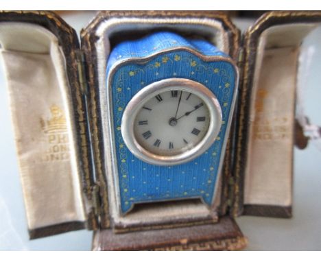 Miniature Continental 925 silver and blue enamel decorated miniature travel clock in a fitted brown leather Asprey of London 