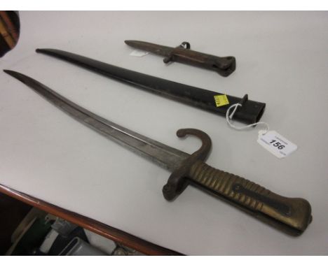 French 1870 pattern bayonet with scabbard together with a small English bayonet