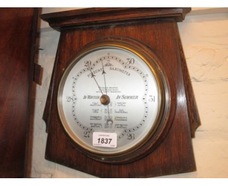 1930's Oak aneroid barometer together with a similar smaller circular aneroid barometer