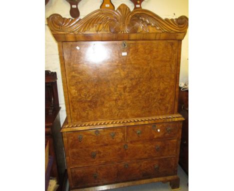 18th / 19th Century Colonial walnut escritoire with a carved foliate cornice above a fall front enclosing drawers / alcoves a