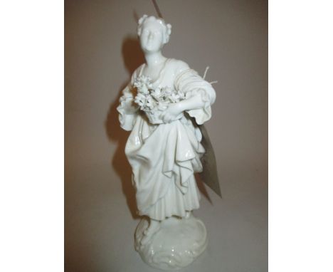 19th Century Blanc de Chine figure holding a basket of flowers, with impressed letter R and numerals to base, 10.25ins high