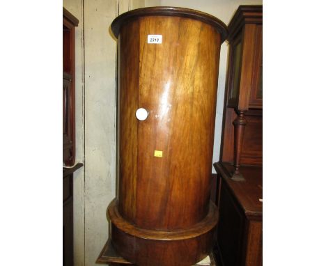 Walnut circular pot cupboard with marble inset top, ceramic and brass handle raised on a plinth base, 15ins diameter x 29ins 