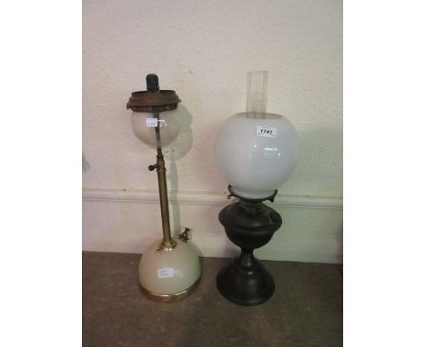 Copper oil lamp with opaque glass shade and a brass and cream tilley lamp
