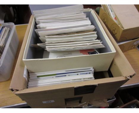 Two boxes containing a quantity of loose G.B. First Day covers