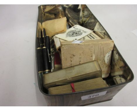 Small box containing various fountain pens, playing cards and sundries