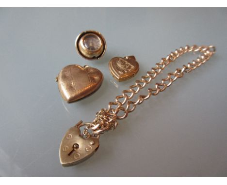 9ct Gold chain link bracelet with lock clasp, two gold heart shaped lockets and a yellow metal pendant in the form of a compa