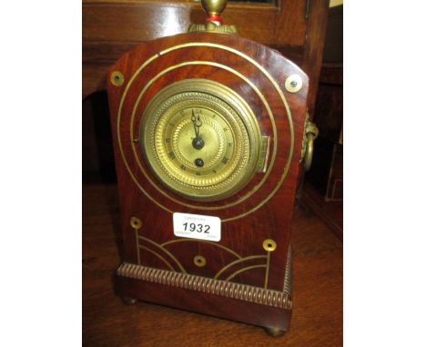 Regency mahogany and inlaid mantel clock, the circular gilt dial with Roman numerals with a single train silk suspension move