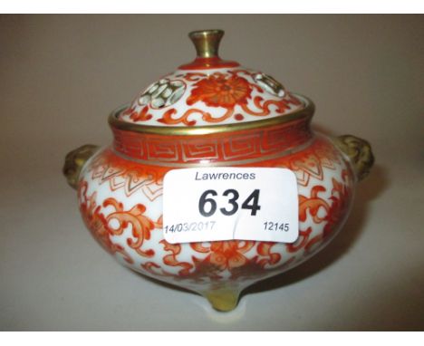 Small Chinese porcelain censer decorated with all-over iron red and gilt on three shaped supports, seal mark to the base, 3.5