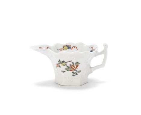 A Worcester creamboat, circa 1754Of hexagonal form with a geranium leaf moulded under the spout, the angular handle with a sc