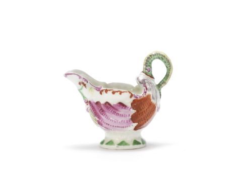 A Worcester creamboat, circa 1765Of 'dolphin ewer' form, finely potted and moulded in the form of a shell with a pedestal foo