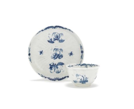 A Worcester teabowl and saucer, circa 1756-58Of thinly potted strap-fluted form, the crisply moulded panels painted in blue w