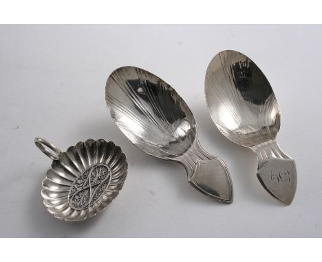 A GEORGE III FLUTED OVAL CADDY SPOON with a ring handle & an inset, filigree panel in the bowl, by Samuel Pemberton, Birmingh