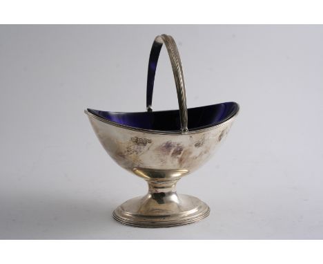 A MODERN SWING HANDLED SUGAR BOWL on an oval foot (blue glass liner), by R. Pringle, Chester 1929;  5.9"  (15 cms) long;  5.9