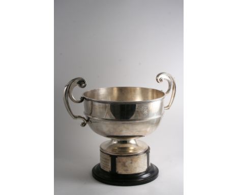 A LARGE TWO-HANDLED CUP with a circular bowl, applied moulded girdle & harp-shaped handles, engraved on one side with a coat 