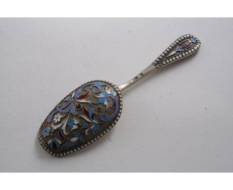 A LATE 19TH CENTURY RUSSIAN CLOISONNE ENAMELLED CADDY SPOON with a gilt bowl, with State marks for 1896-1908;  4.3"  (11 cms)