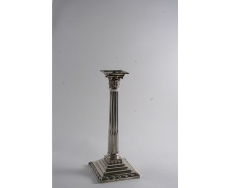 A GEORGE III CANDLESTICK with a fluted column, stepped square base & foliate capitol, scratchweight "27-3", one with the make