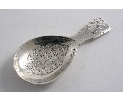 A CADDY SPOON with a lug handle, drop-shaped bowl & panels of engraved, lattice-work decoration, by Liberty & Co., Birmingham