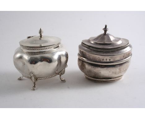 A TEA CADDY  on four feet with gadrooned borders, by the Goldsmiths & Silversmiths Co.Ltd., London 1915 & another with a flat
